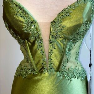 Sherri Hill 56998. Sage fitted off the shoulder gown with sheer bodice.